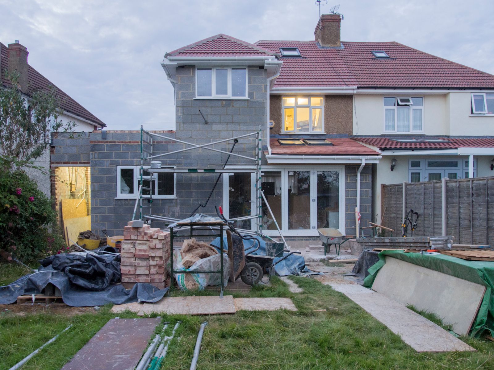 A house wrapped in scaffolding during renovation